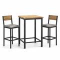 Conjunto de bar de madera y metal negro con sillas grises